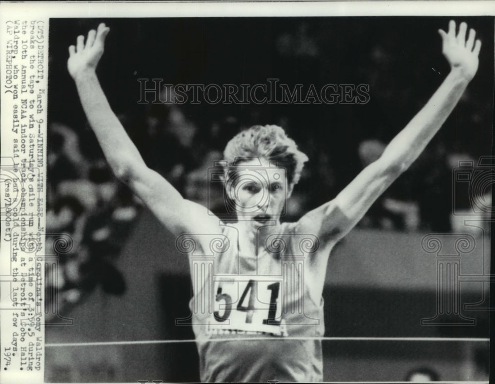 1974 Press Photo Tony Waldrop Breaks the Tape to Win a One Mile Run Race- Historic Images