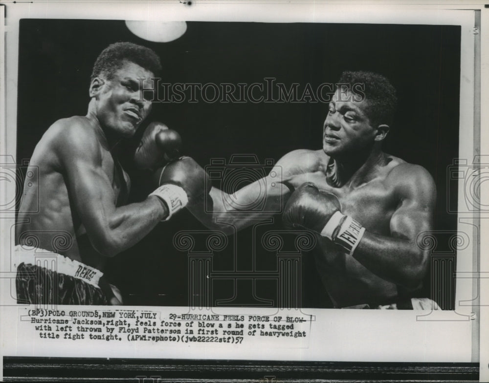 1957 Press Photo Boxer Hurricane Jackson gets hit by Floyd Patterson - sps13208- Historic Images