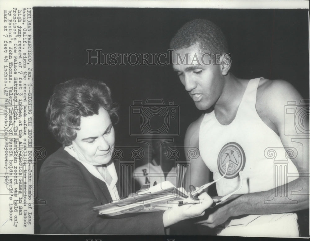 1967 Press Photo Track high humer John Rambo, Long Beach, California signs book- Historic Images