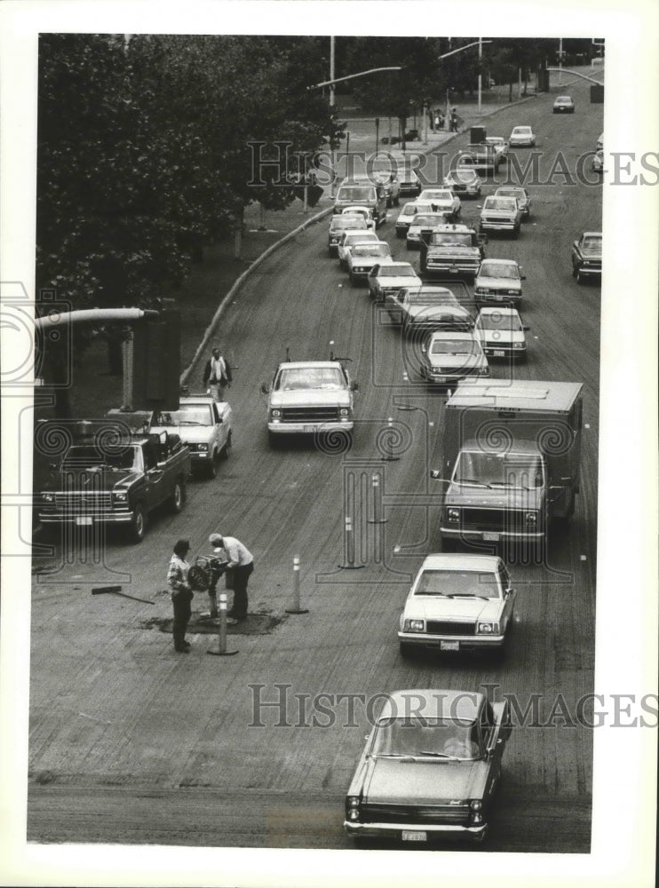 1987 Press Photo Workers prepare city streets for the Spokane Grand Prix- Historic Images