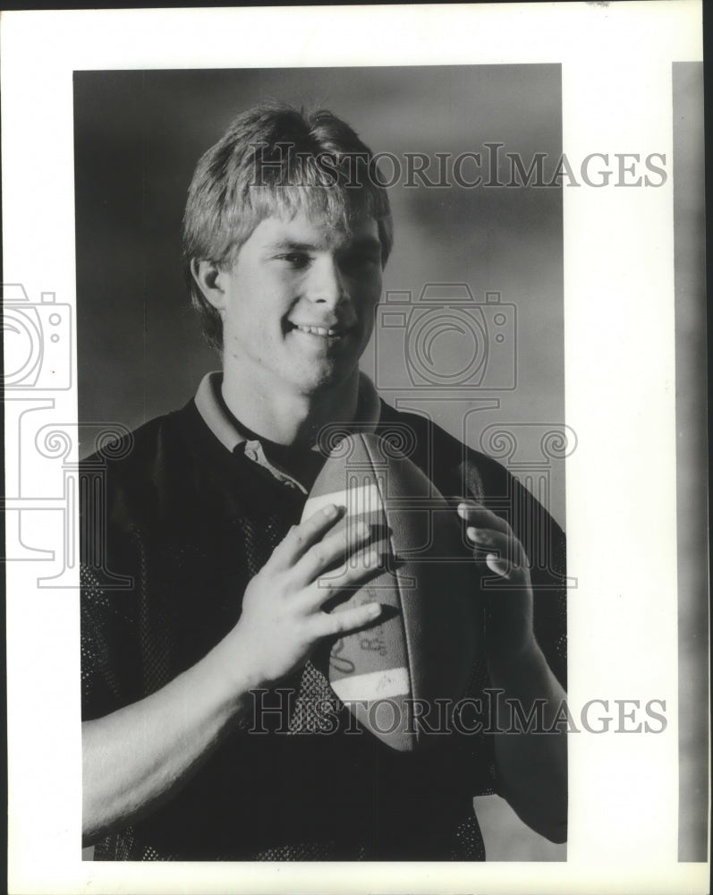 1987 Press Photo Jason Reed, Cheney High football player, poses holding the ball- Historic Images