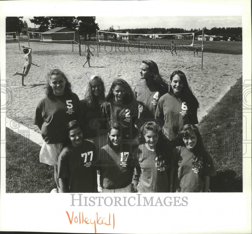 Valley Volleyball Club players pose for group picture with background volleyball- Historic Images