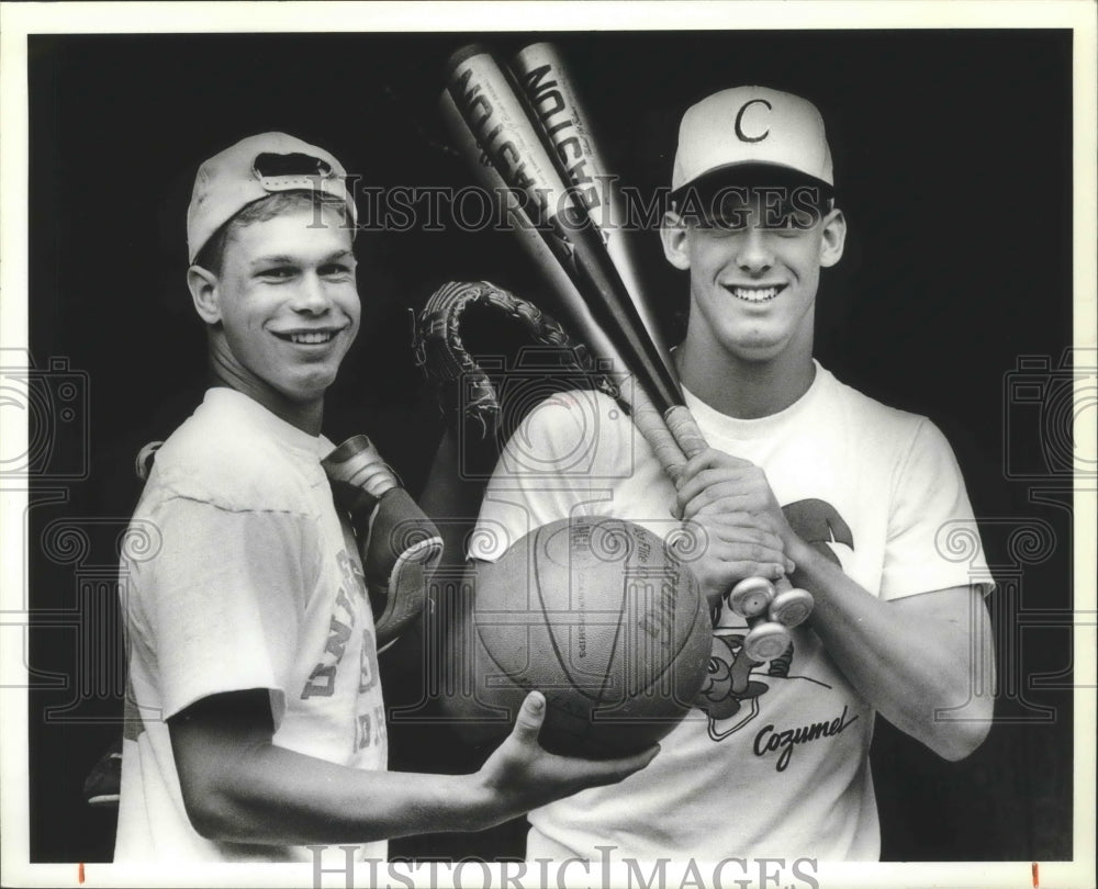 1987 Press Photo Kelly and Jeff Moffat hold equipment from 3 sports they play- Historic Images