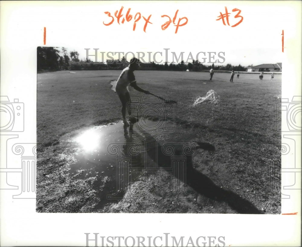 1990 Press Photo Little League Baseball Mustangs Assistant Coach Cleaning a Base- Historic Images