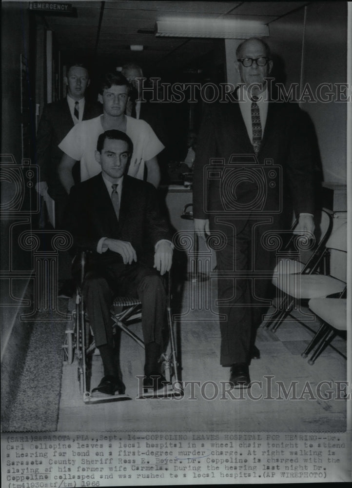 1966 Press Photo Dr. Carl Coppoline leaving a local hospital in a wheel chair- Historic Images