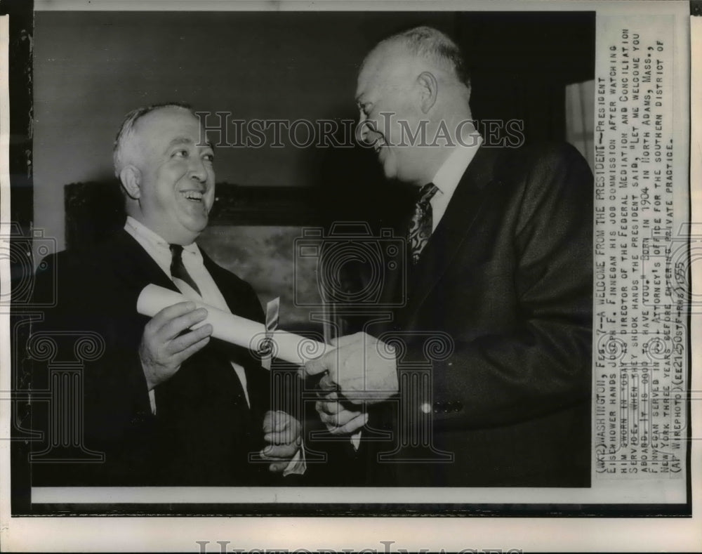 1955 Press Photo Pres. Eisenhower handing Joseph F. Finnegan his job commission- Historic Images