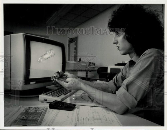 1987 Press Photo Engineer Jay Ryan with Aircraft Part and CAD/CAM Drawing- Historic Images