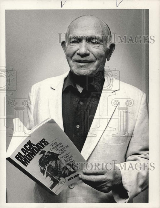 1990 Press Photo Harold Chernock holds the "Black Mondays" book - sra13356- Historic Images