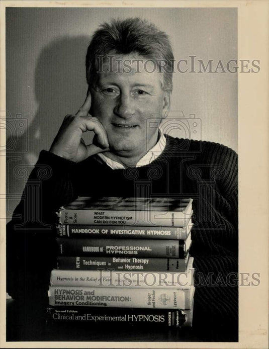 1990 Press Photo J. Francis Cloutier displays his hypnosis books in Bridgewater.- Historic Images
