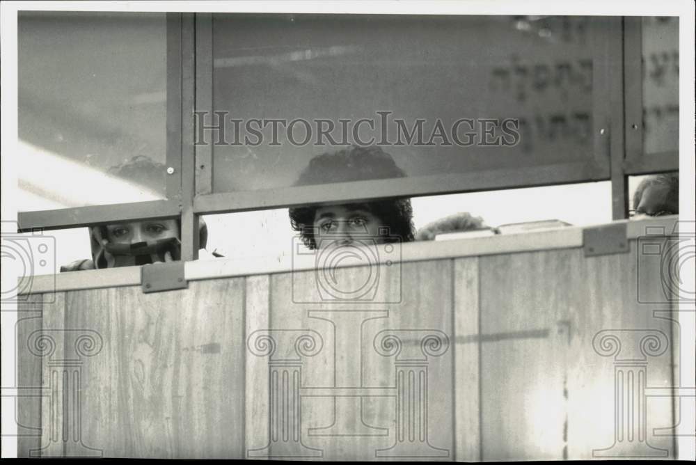 Press Photo Lubavitchers looking through windows - sra31813- Historic Images