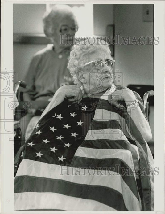 1989 Press Photo Angeline Pezzini holds the American Flag at Senior Olympics, MA- Historic Images