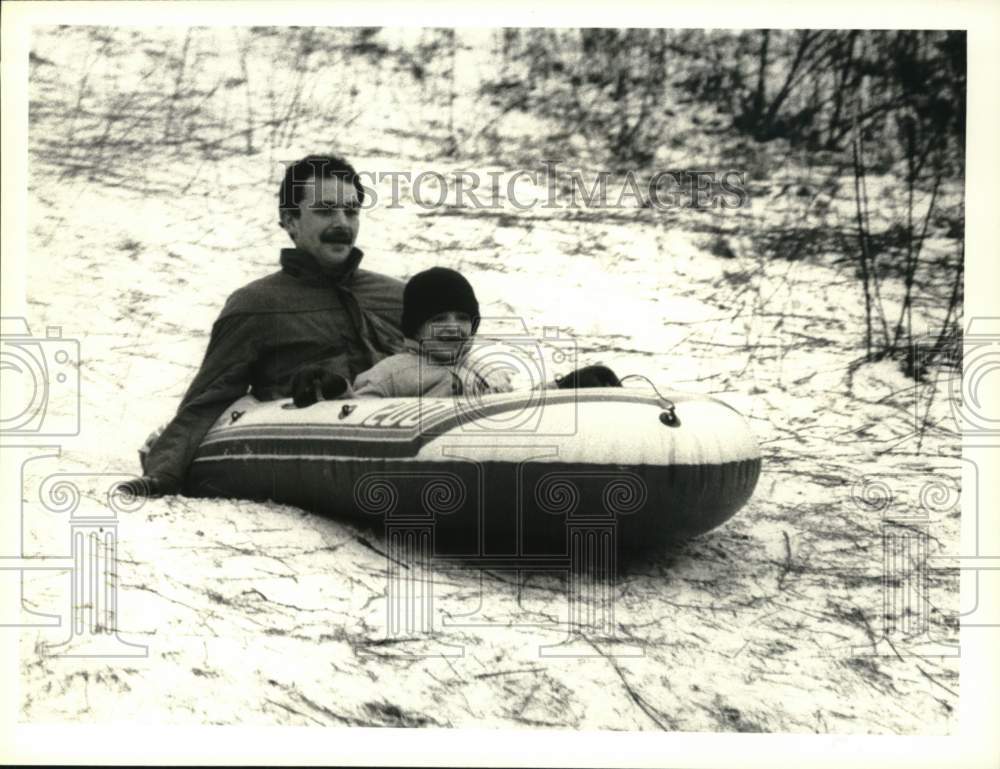 1988 Press Photo Jeremy and Steve VanCise Snow Sledding at Beaudry Park- Historic Images