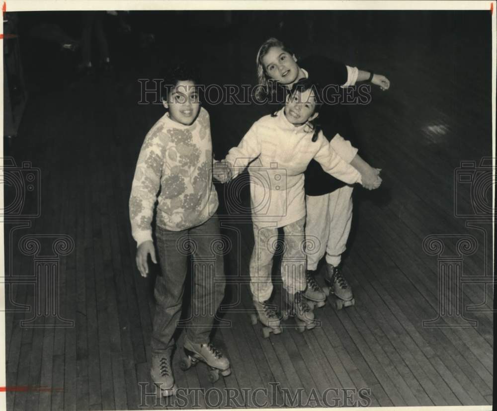 Press Photo Children Rollerskating on Rink - sya11126- Historic Images