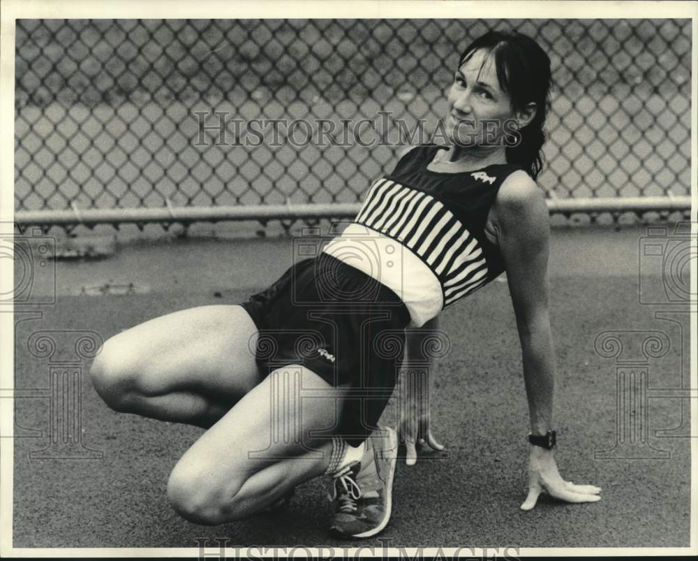 Press Photo Runner Sue Terwilliger Stretching at Track - sya11485- Historic Images