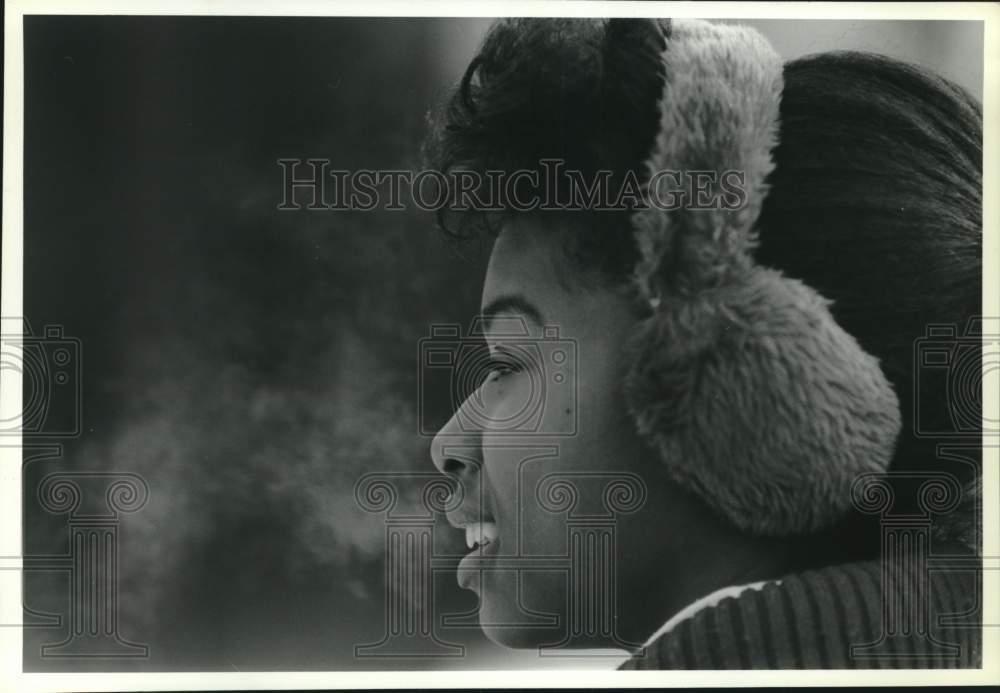 1989 Press Photo Woman Wearing Ear Muffs in Winter Profile - sya12003- Historic Images