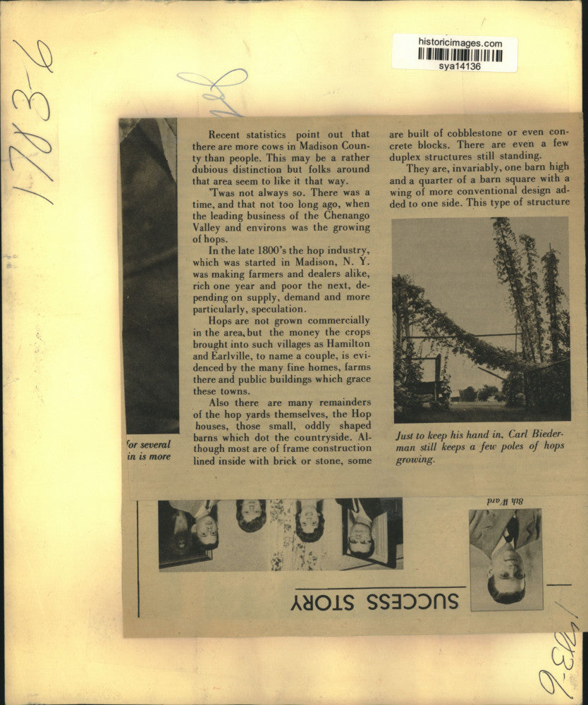 Press Photo Man in Office with Blueprints and Maps - sya14136