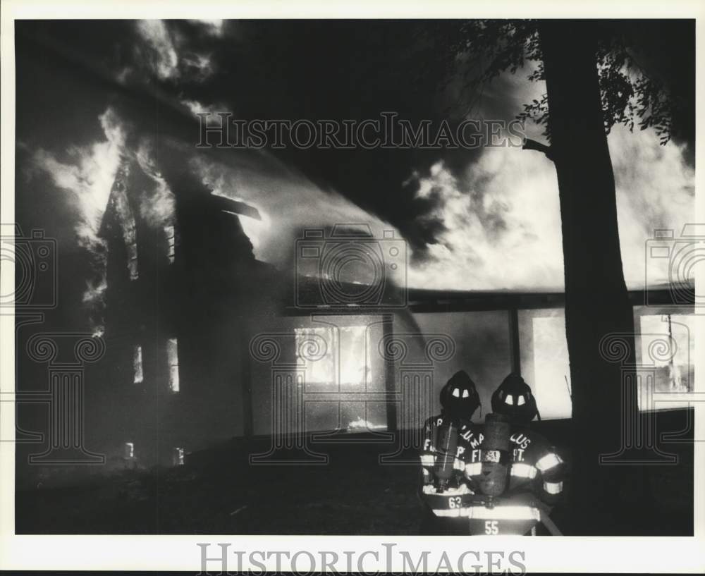 1989 Press Photo Marcellus Firefighters Work on Log Home Fire in Spafford- Historic Images