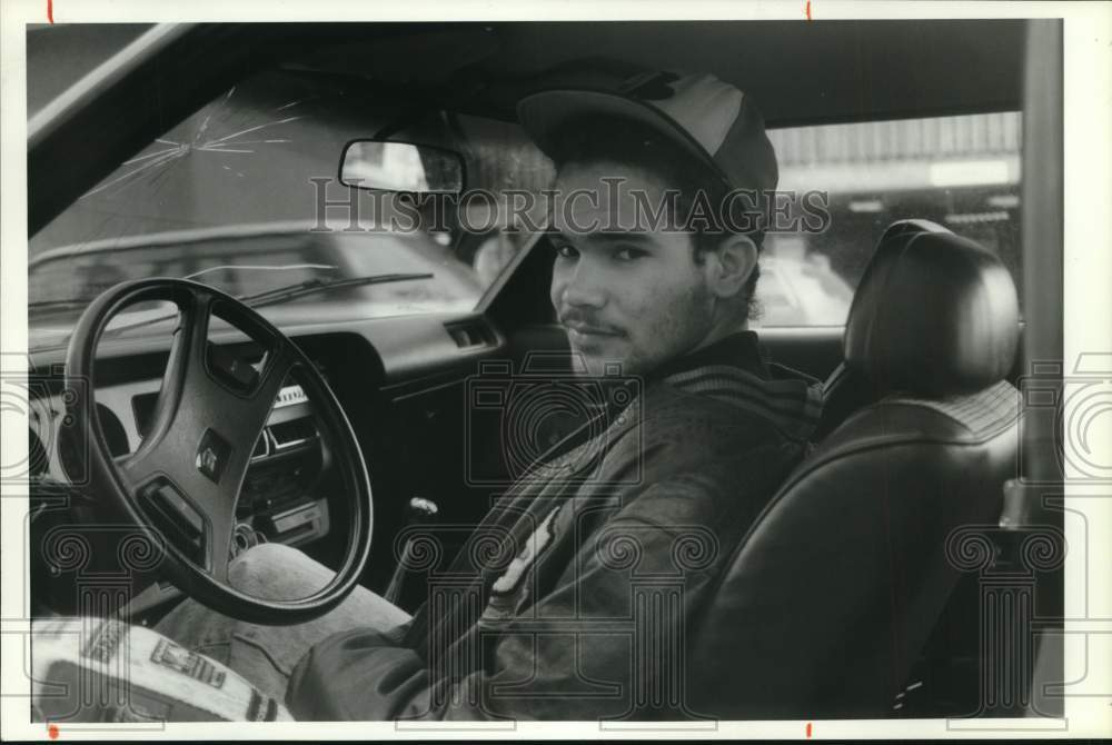 1991 Press Photo Marco de la Cruz in Car Driver&#39;s Seat - sya45169- Historic Images