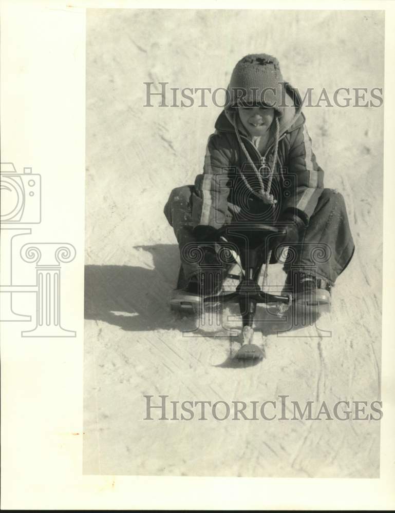 Press Photo Auburn-Chucky Donato,10, sledding down the hill at Griffin Park- Historic Images