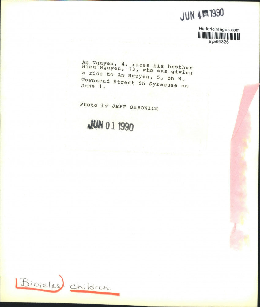 1990 Press Photo Hieu Nguyen Riding Bicycle with Brothers in Syracuse, New York