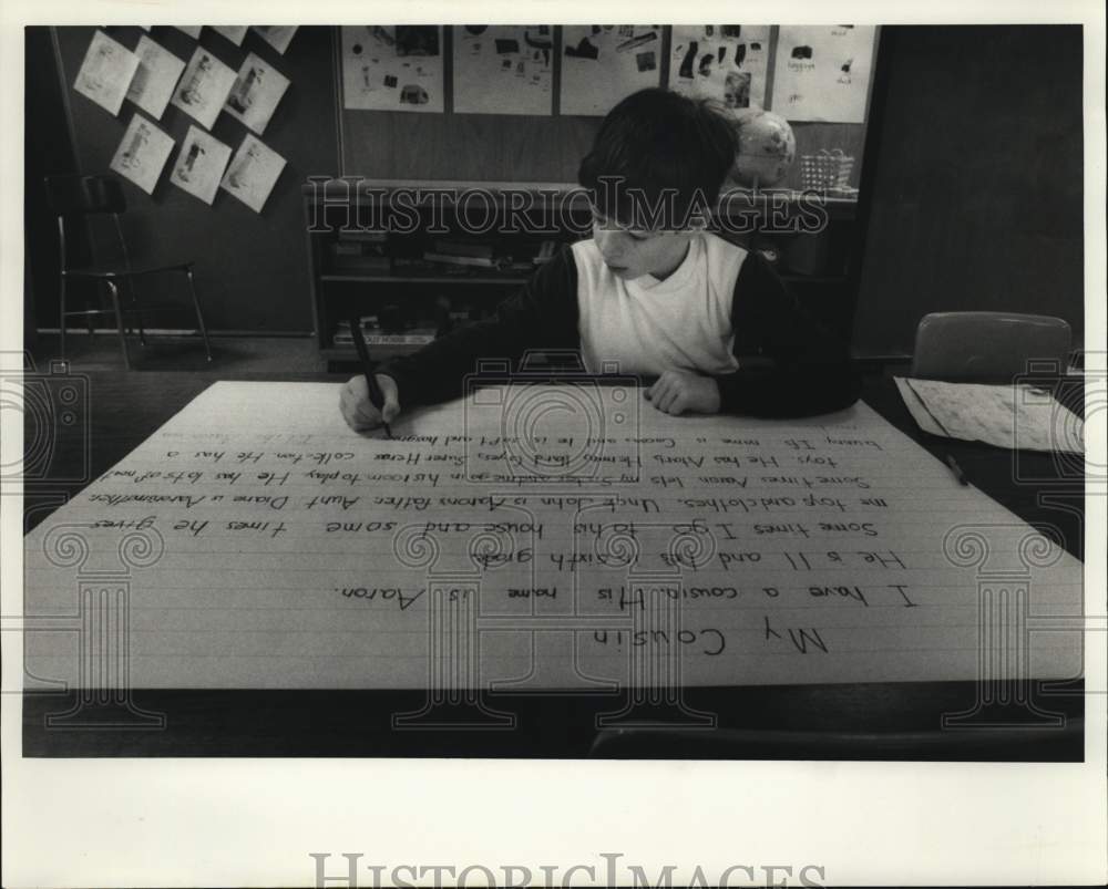 1986 Press Photo Ryan Maloney writes in Long Branch School Program - sya78261- Historic Images