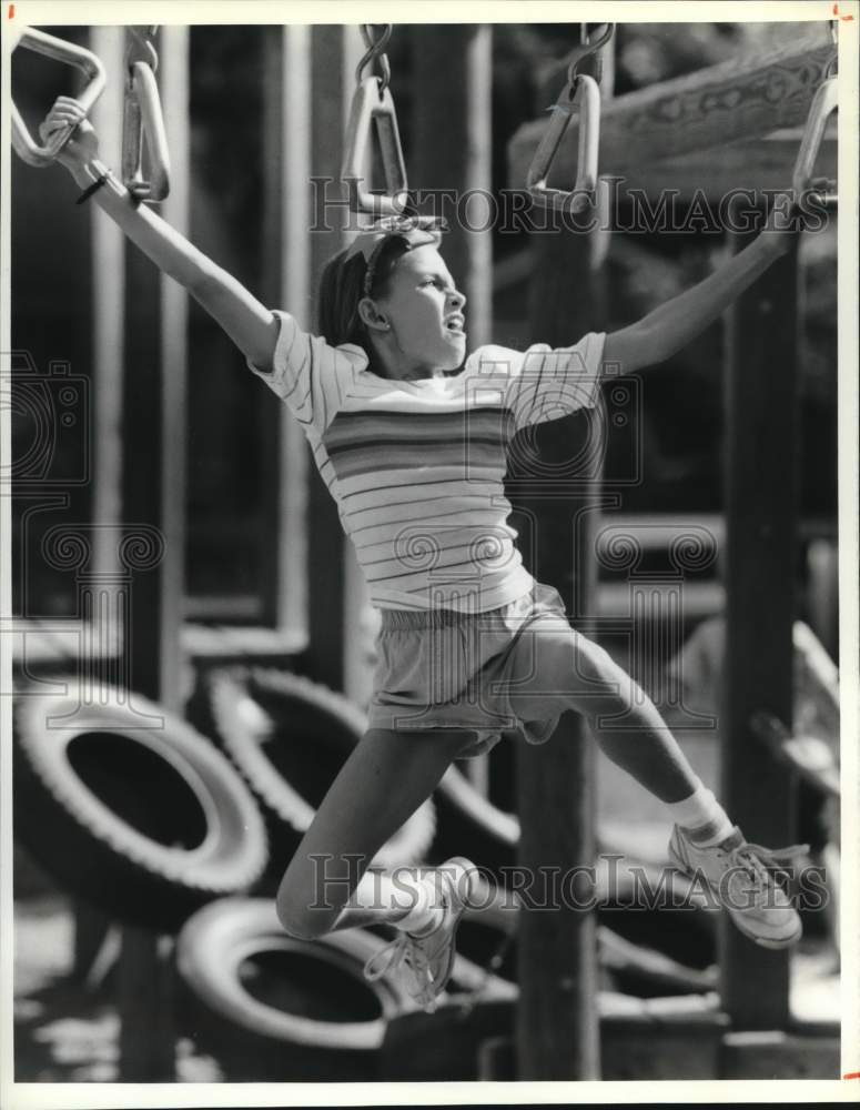 1989 Press Photo Megan Smith plays at Oneida Community Playground, New York- Historic Images