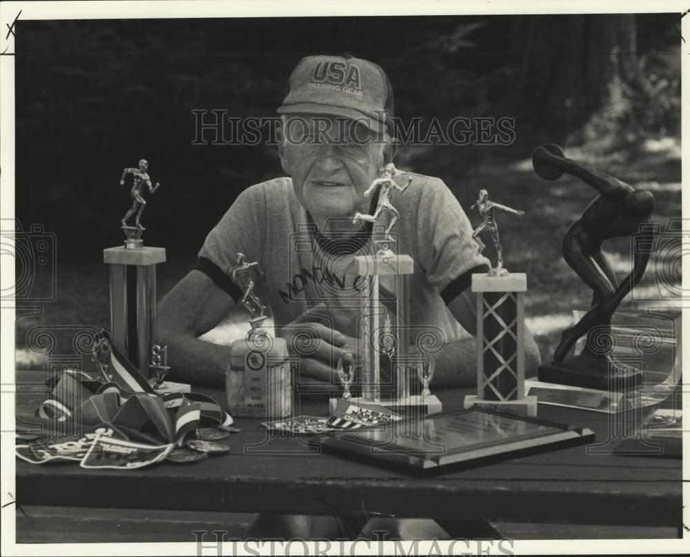 1987 Press Photo Charlie Hackenheimer Poses with Running Trophies in Brewerton- Historic Images