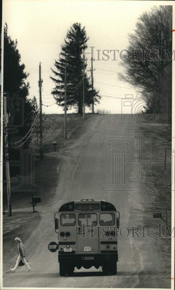 Press Photo Student Dropped Off by School Bus in Volney, New York - sya85506- Historic Images