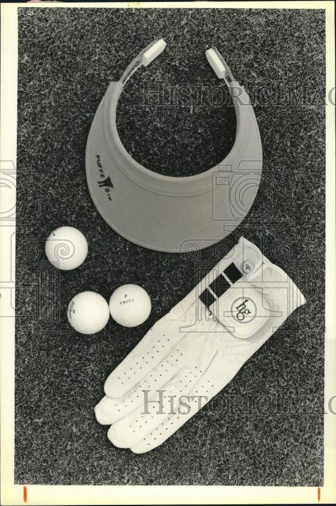 1988 Press Photo Golf Visor, Balls &amp; Glove - sya85580- Historic Images