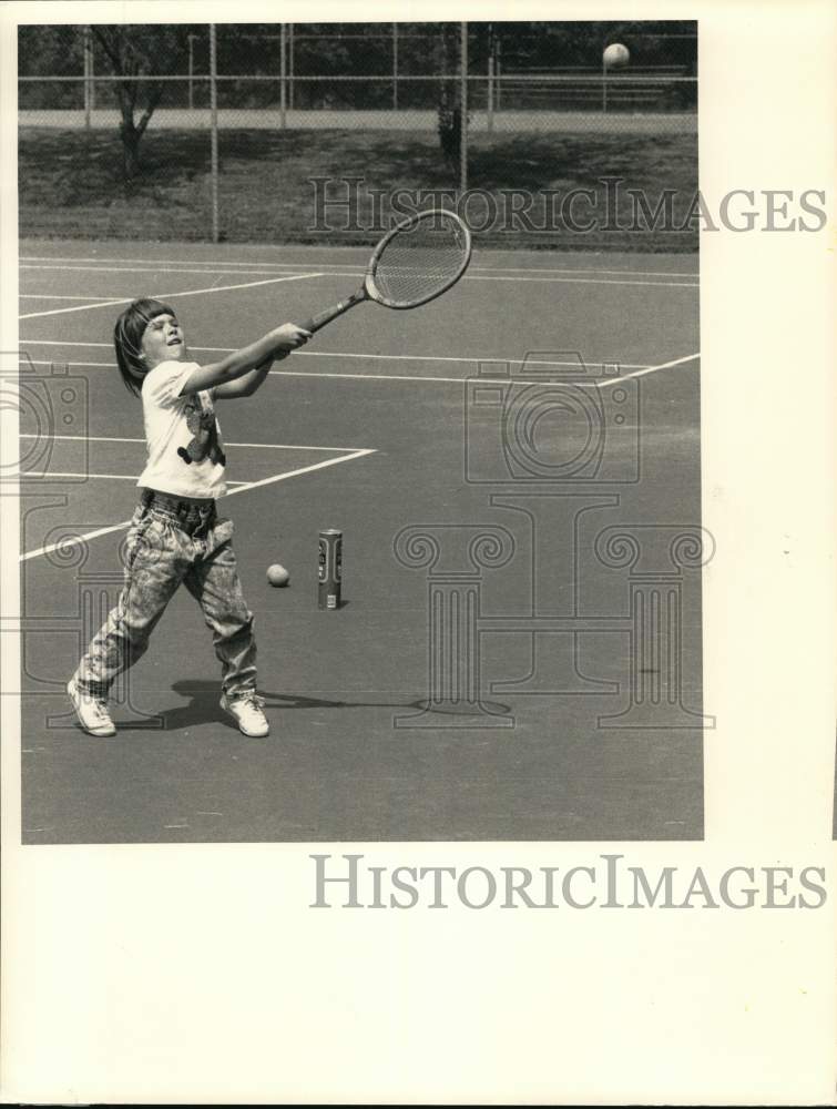 1988 Press Photo Stacy Aowland practices Tennis at Casey Park, Auburn, New York- Historic Images