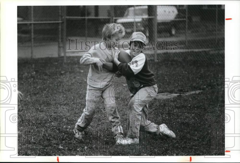 1990 Press Photo Jason Holden and Eddie Fitzgerald Playing Football in Watertown- Historic Images