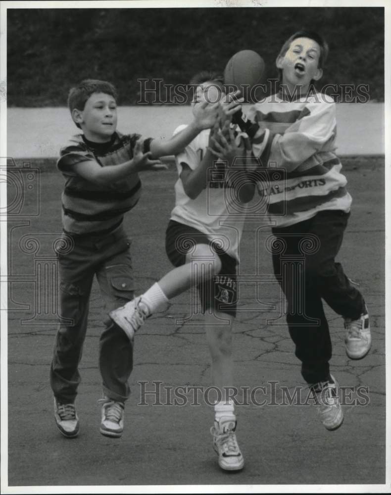 1990 Press Photo Friends Playing Football on Mertens Avenue in Syracuse- Historic Images