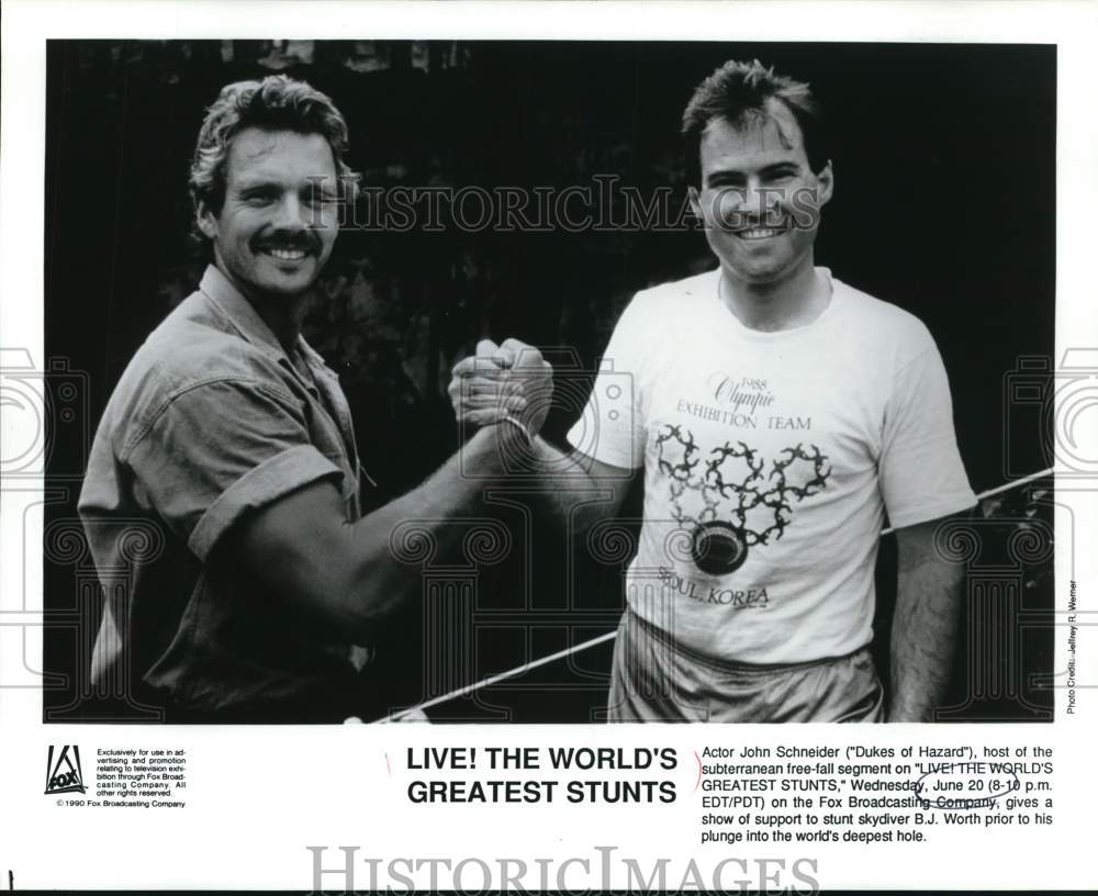 1990 Press Photo John Schneider and B.J. Worth on &quot;The Worlds Greatest Stunts&quot;- Historic Images