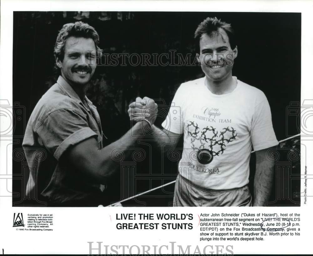 1990 Press Photo John Schneider and B.J. Worth on "The Worlds Greatest Stunts"- Historic Images