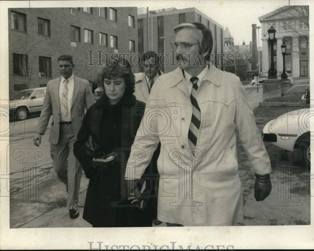 1986 Press Photo Melba and William Monson Walking Downtown - sya95402- Historic Images