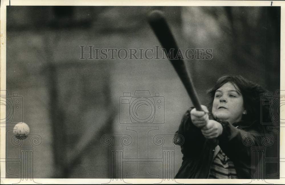 1984 Press Photo Girl swings at Baseball- Historic Images