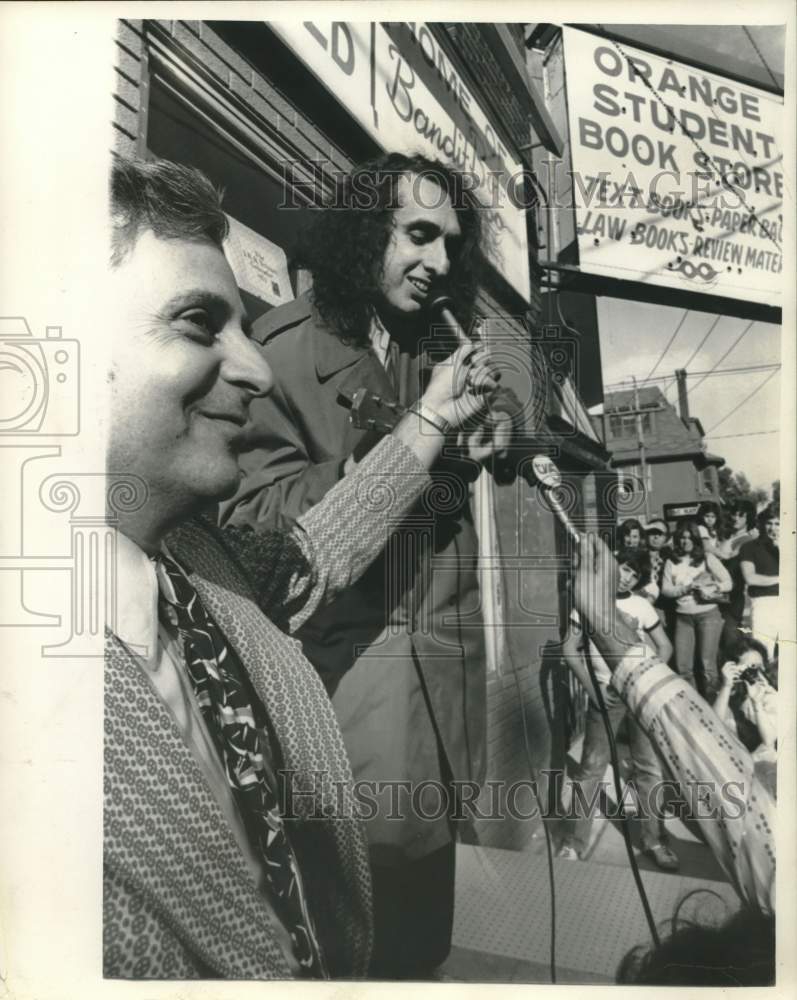 1974 Press Photo Tim Tenej speaks into a microphone - syp00657- Historic Images