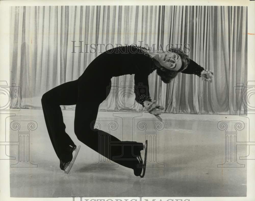 Press Photo Ice skater performs a routine - syp14370- Historic Images