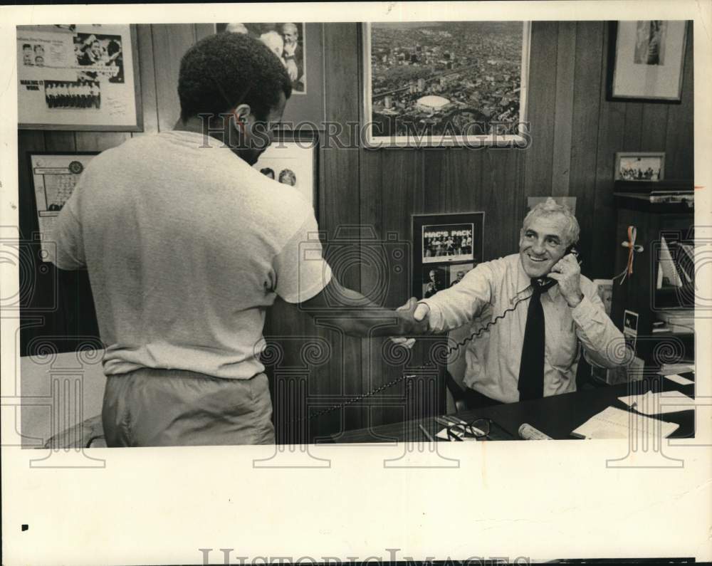 1982 Press Photo Dick MacPherson with Athlete in Office - syp36146- Historic Images