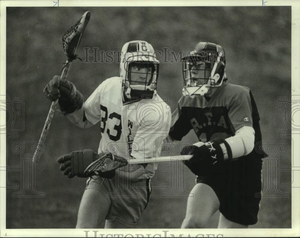 1985 Press Photo West Genesee High lacrosse&#39;s Neil James and opponent- Historic Images