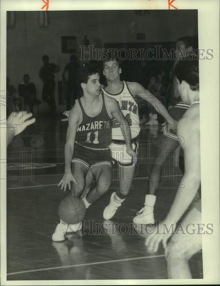 1986 Press Photo Nazareth College basketball guard Joe Convert dribbles in game- Historic Images