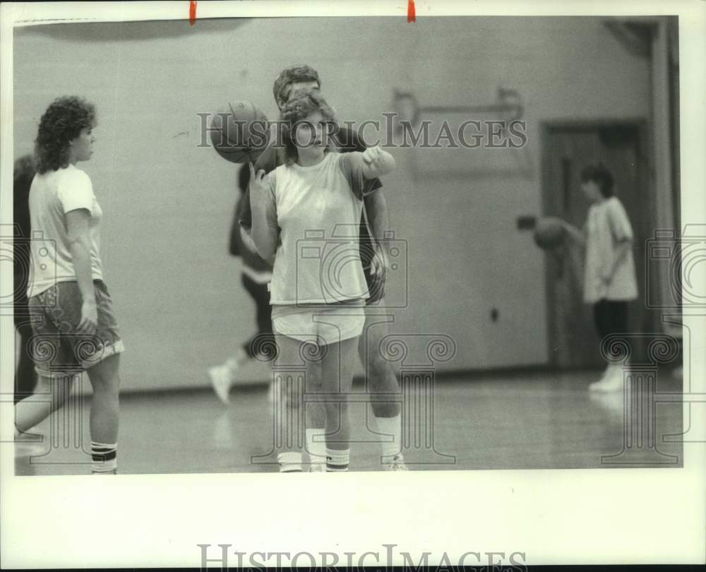 Press Photo Madison's Cory Hughes balancing basketball - sys05138- Historic Images