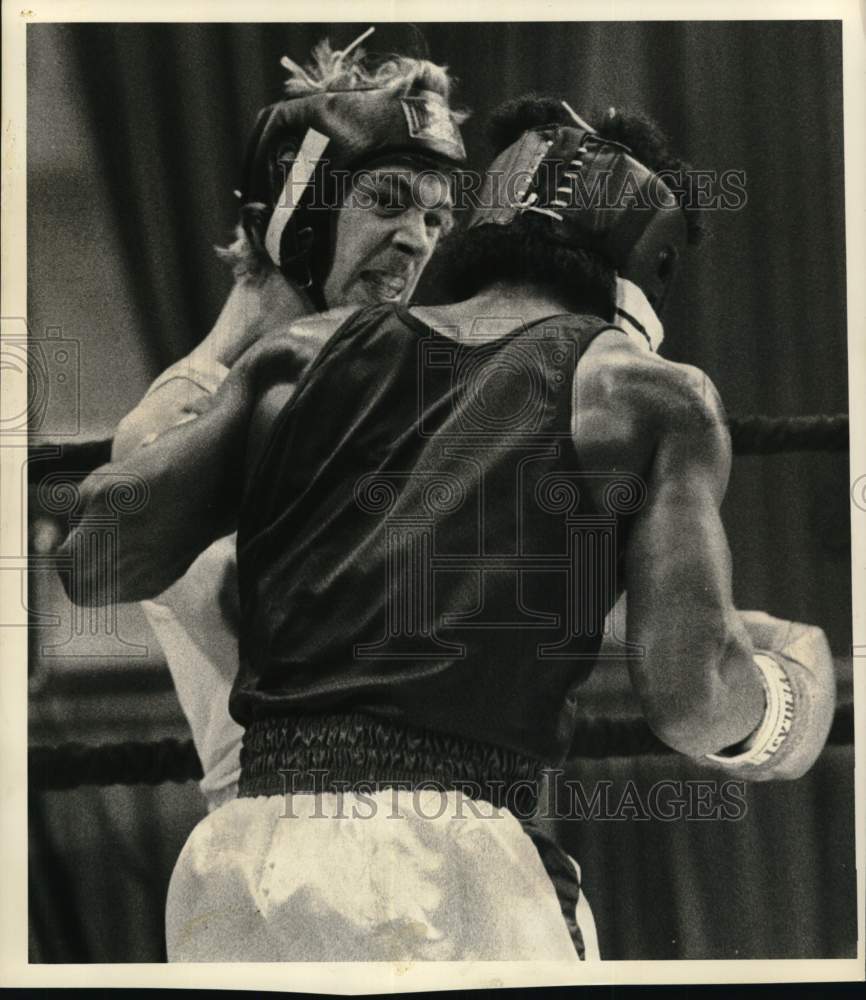 1983 Press Photo Boxer Raymond Wilkins uppercuts Rodney Brandon at Carrier Dome- Historic Images