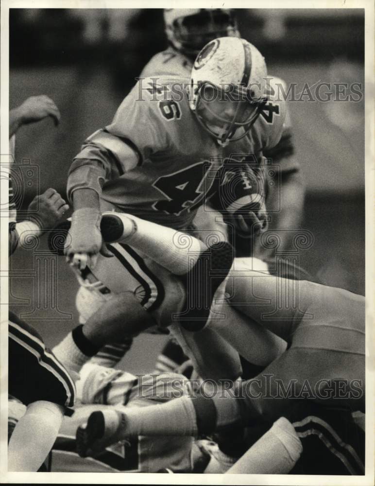 1984 Press Photo Football Player Norm Deep against Grimes in New York Game- Historic Images