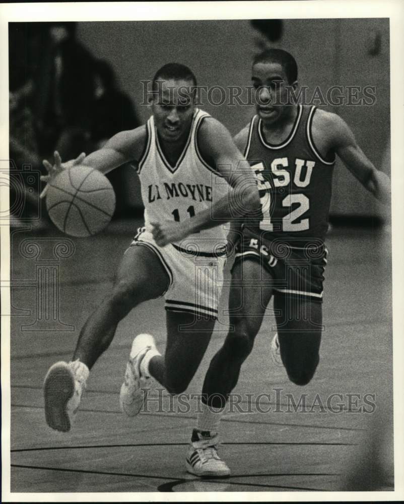 1986 Press Photo LeMoyne basketball player Walter Hill drives past ESU defender- Historic Images