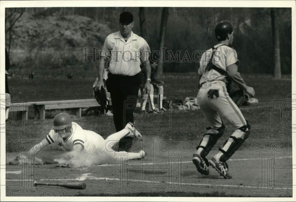 1988 Press Photo Dave Wheelers slides into home, Scot Pritchard in Baseball Game- Historic Images