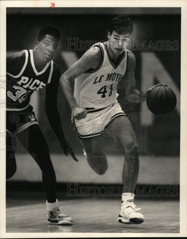 1990 Press Photo LeMoyne basketball player Christian Bucholz dribbles by player- Historic Images