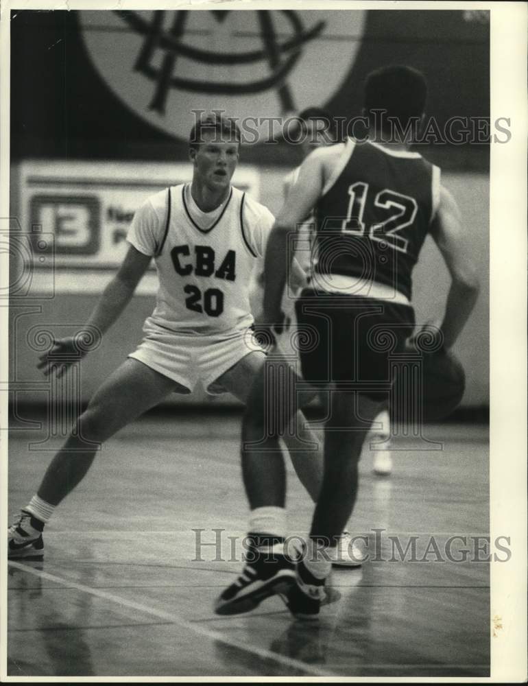 1988 Press Photo Christian Brothers Academy basketball player Mark Adams guards- Historic Images