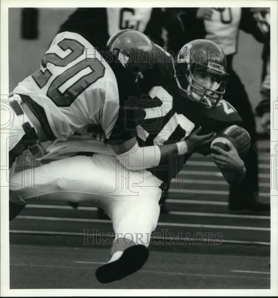 1990 Press Photo Cornell University football player Mike Grant fumbles the ball- Historic Images