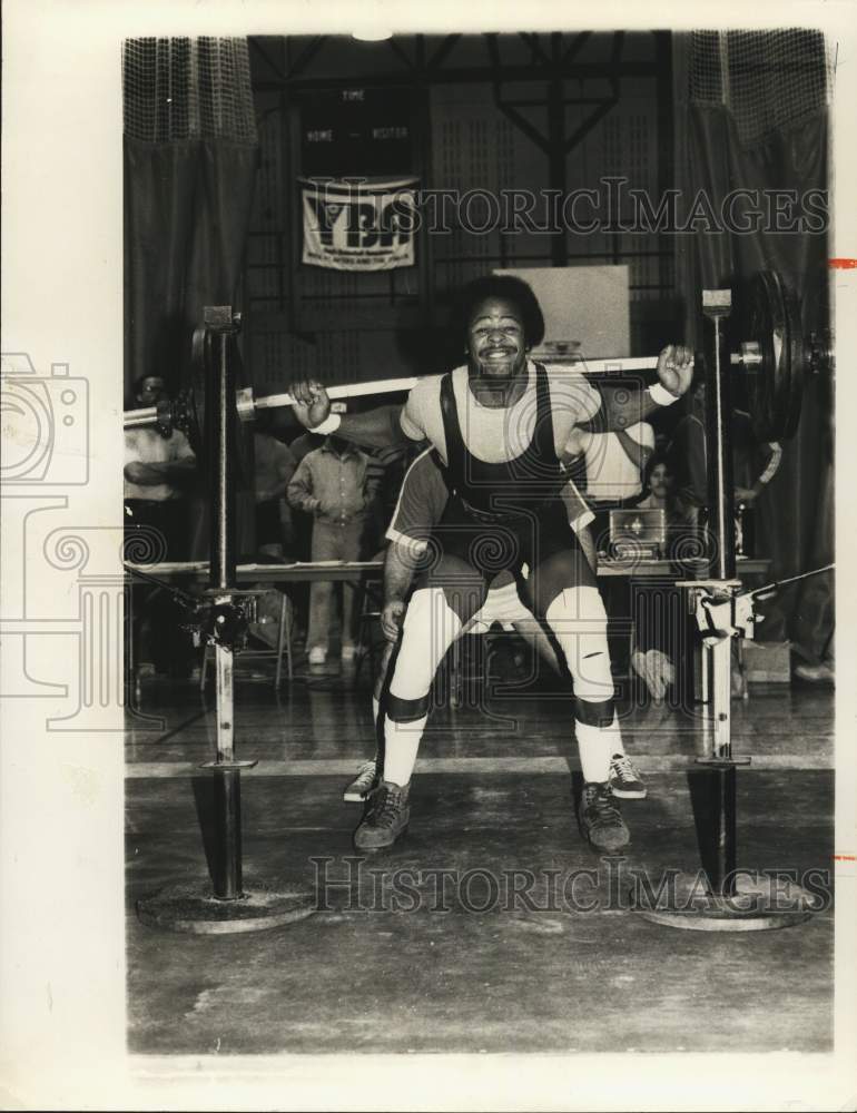 Press Photo Young man weight lifting.- Historic Images